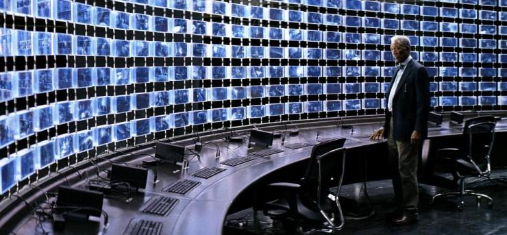 Lucius Fox monitors surveillance of Gotham City in The Dark Knight