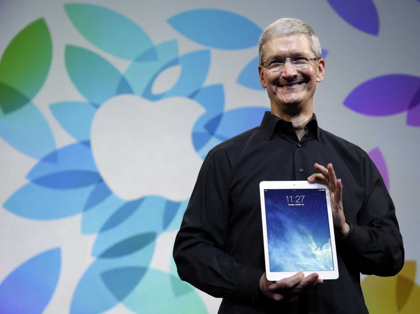 Tim Cook holds iPad Air