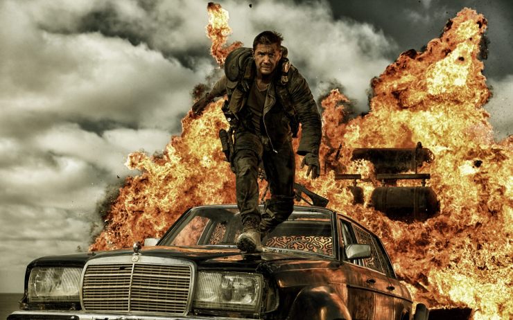 Max leaps from an explosion in Mad Max: Fury Road